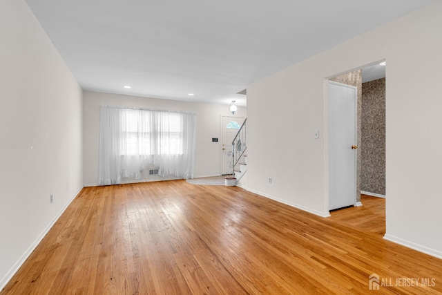 30 Daniel Dr, Matawan, NJ 07747 - spare room featuring light wood-style floors and stairway