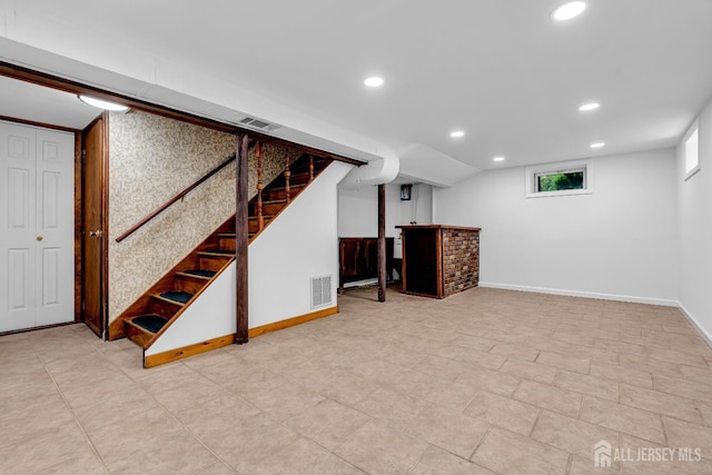 30 Daniel Dr, Matawan, NJ 07747 - basement with recessed lighting, stairway, and a dry bar
