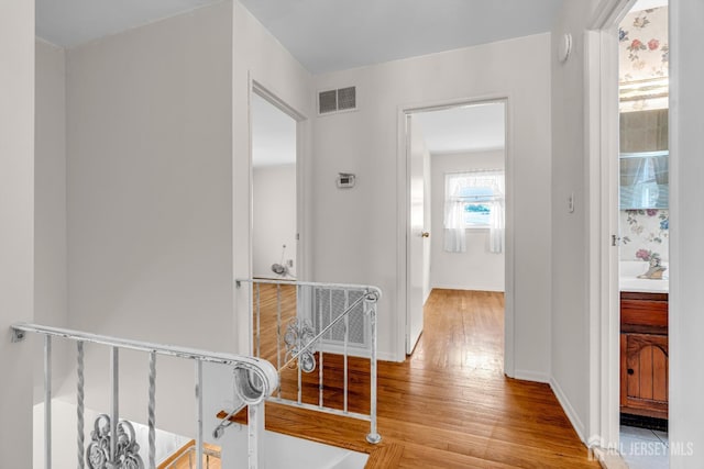 30 Daniel Dr, Matawan, NJ 07747 - hallway with wood finished floors and an upstairs landing