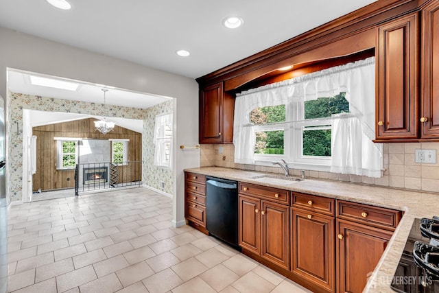 30 Daniel Dr, Matawan, NJ 07747 - kitchen featuring black dishwasher, wallpapered walls, a chandelier, tasteful backsplash, and light stone counters