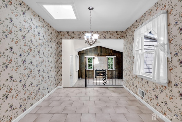 30 Daniel Dr, Matawan, NJ 07747 - dining room with a chandelier, wallpapered walls, and lofted ceiling