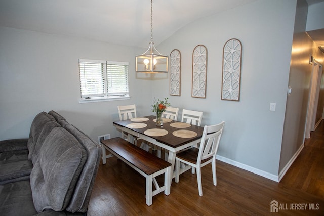 dining space with vaulted ceiling, dark wood-style floors, visible vents, and baseboards