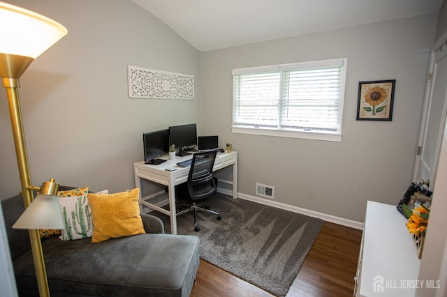 office featuring dark hardwood / wood-style floors and lofted ceiling