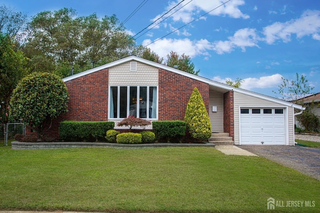 mid-century inspired home featuring a garage, driveway, a front yard, and brick siding