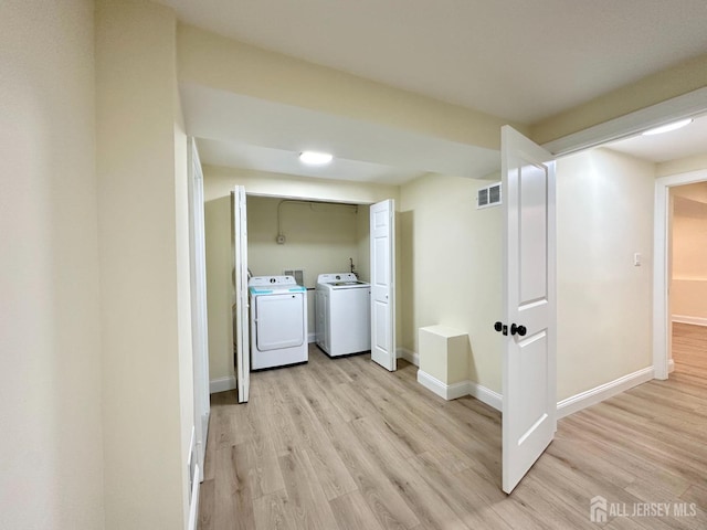 4 Joseph Ct, Old Bridge, NJ 08879 - laundry room with washer and clothes dryer, light wood-style floors, and baseboards