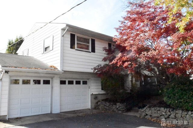 view of side of home with a garage