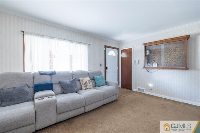 carpeted living room with crown molding