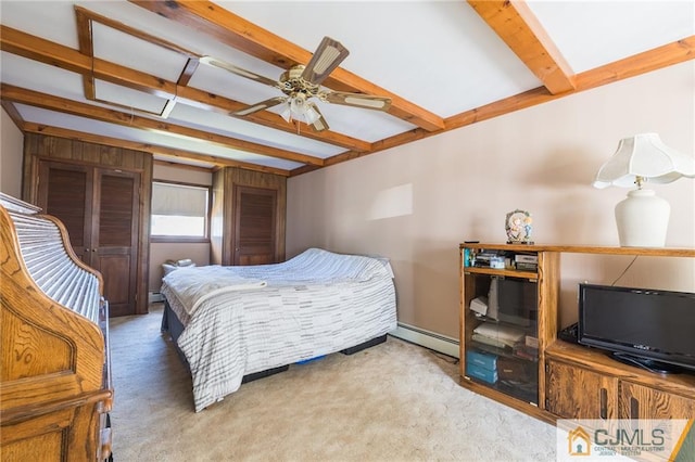 carpeted bedroom with beam ceiling, ceiling fan, and a baseboard radiator