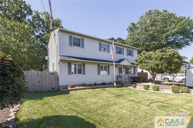 view of front of house with a front yard and a porch