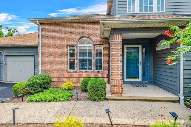 5 Fairway Blvd Unit 5, Monroe, NJ 08831 - property entrance with a garage, brick siding, a porch, and roof with shingles