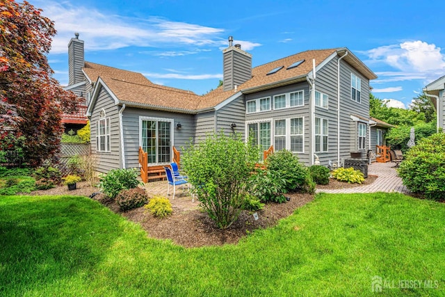 5 Fairway Blvd Unit 5, Monroe, NJ 08831 - rear view of house with a chimney, a yard, and a patio area