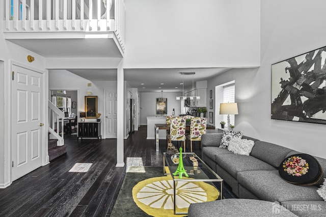 5 Fairway Blvd Unit 5, Monroe, NJ 08831 - living room with a towering ceiling, stairway, and dark wood-style floors
