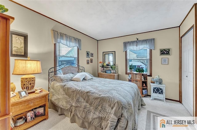 carpeted bedroom featuring baseboards