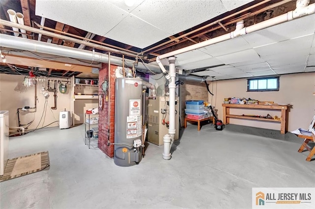 basement featuring water heater and heating unit