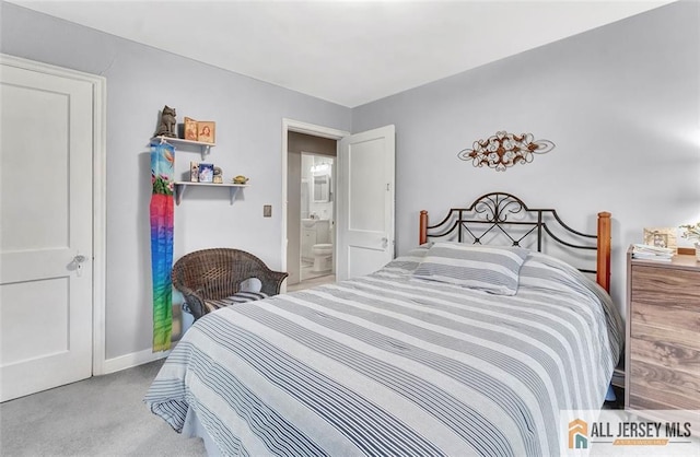 bedroom with baseboards and carpet