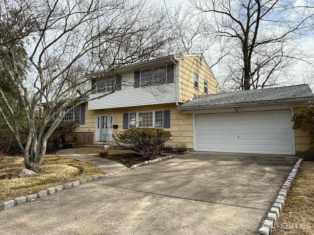 view of front of house featuring a garage and concrete driveway