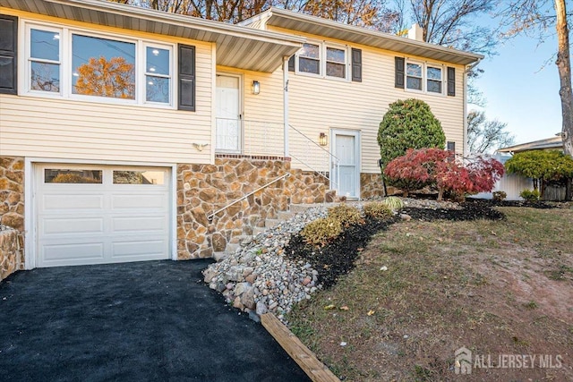 view of front of property with a garage