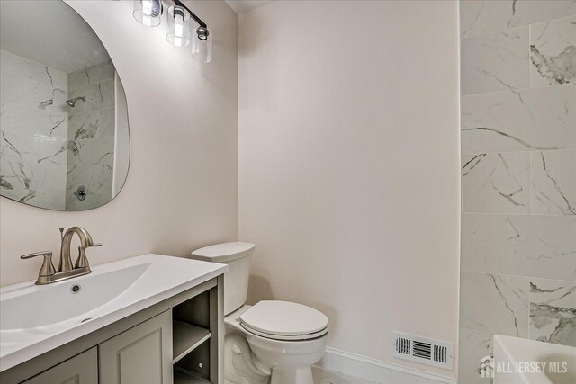 full bath featuring toilet, visible vents, a shower, and vanity