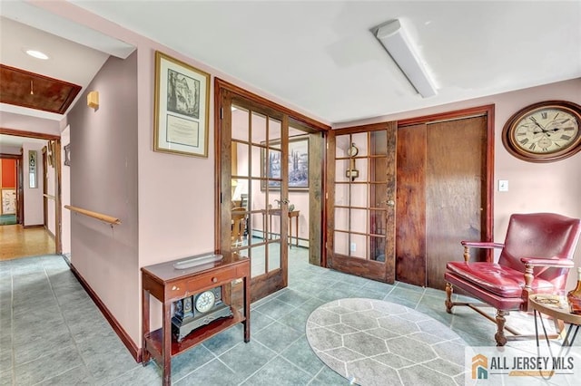 71 Russell St, Woodbridge Proper, NJ 07095 - sitting room featuring french doors, tile patterned floors, and baseboards