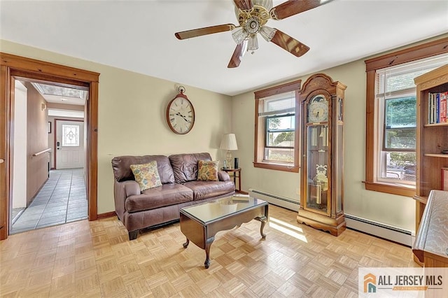 71 Russell St, Woodbridge Proper, NJ 07095 - living room with a baseboard radiator, baseboards, and ceiling fan