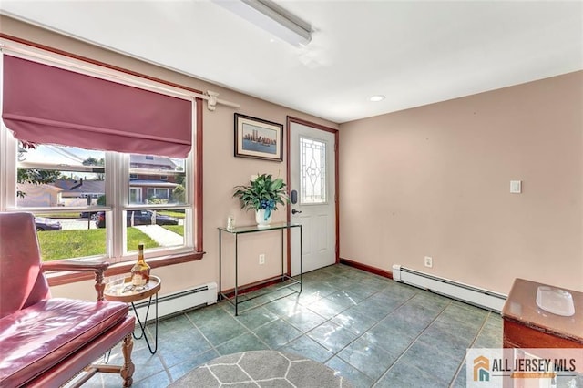 71 Russell St, Woodbridge Proper, NJ 07095 - foyer entrance featuring a baseboard heating unit and baseboards