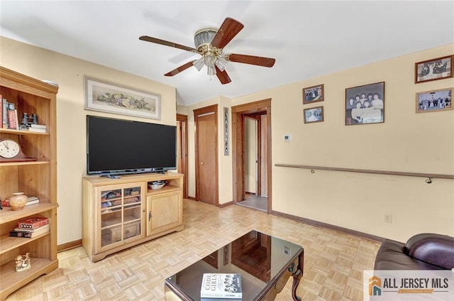 71 Russell St, Woodbridge Proper, NJ 07095 - living room featuring a ceiling fan and baseboards