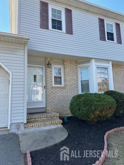 51 Tanbark Dr, Sayreville, NJ 08859 - entrance to property featuring brick siding