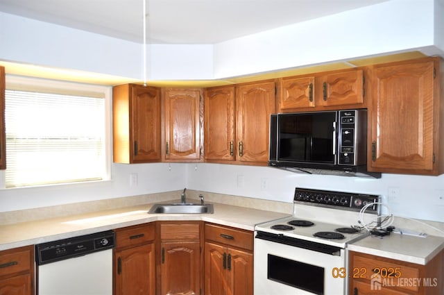 2 Aaron Burr Ct Unit A, Monroe, NJ 08831 - kitchen featuring white appliances, a sink, brown cabinets, and light countertops