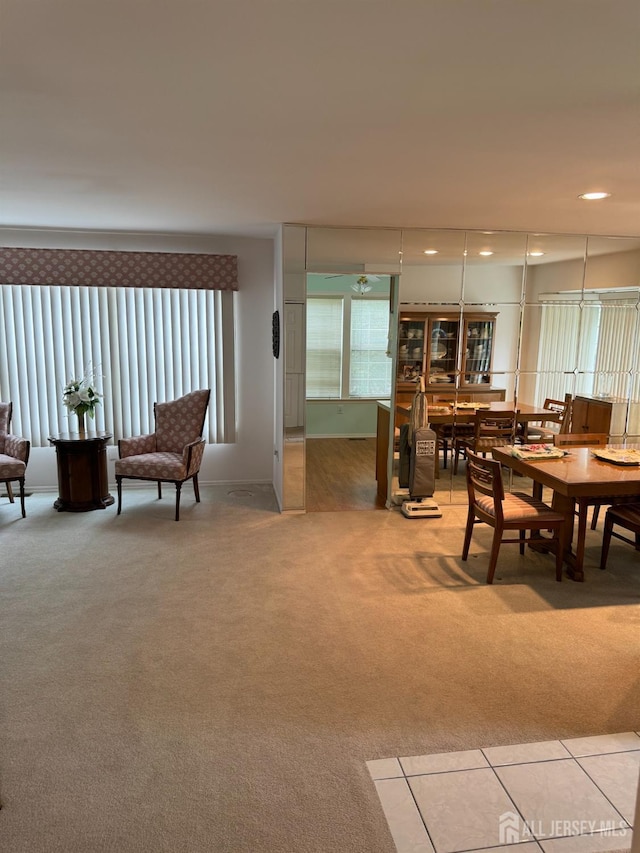 dining area featuring recessed lighting and light carpet