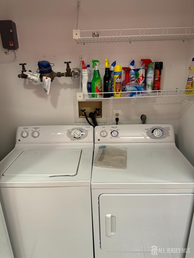 laundry area featuring washing machine and clothes dryer