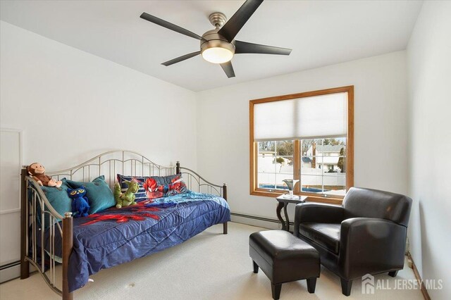 bedroom with baseboard heating, a ceiling fan, and carpet floors