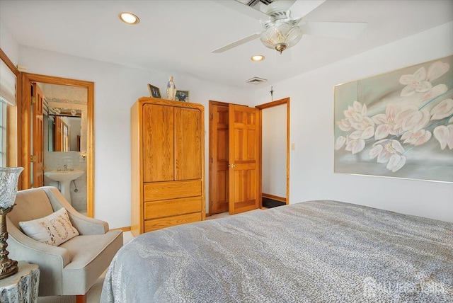 bedroom featuring visible vents, baseboards, recessed lighting, a ceiling fan, and a sink