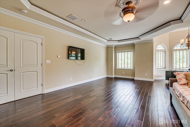 87 Ellmyer Rd, Edison, NJ 08820 - unfurnished living room featuring a raised ceiling, ceiling fan, dark wood-style floors, crown molding, and a chandelier