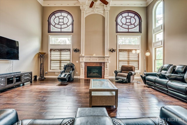 87 Ellmyer Rd, Edison, NJ 08820 - living area featuring a high ceiling, ornamental molding, a fireplace, hardwood / wood-style flooring, and ceiling fan