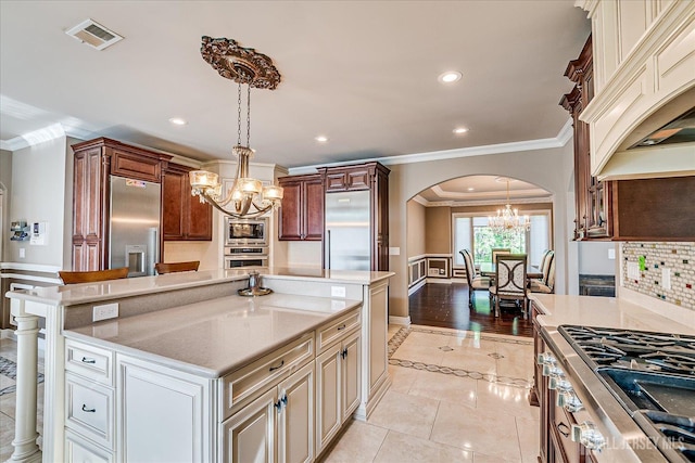 87 Ellmyer Rd, Edison, NJ 08820 - kitchen featuring a chandelier, stainless steel appliances, crown molding, arched walkways, and light tile patterned floors