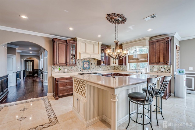 87 Ellmyer Rd, Edison, NJ 08820 - kitchen with light countertops, ornamental molding, arched walkways, premium range hood, and recessed lighting