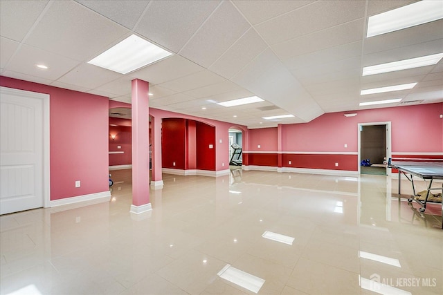 87 Ellmyer Rd, Edison, NJ 08820 - tiled empty room featuring arched walkways and a drop ceiling