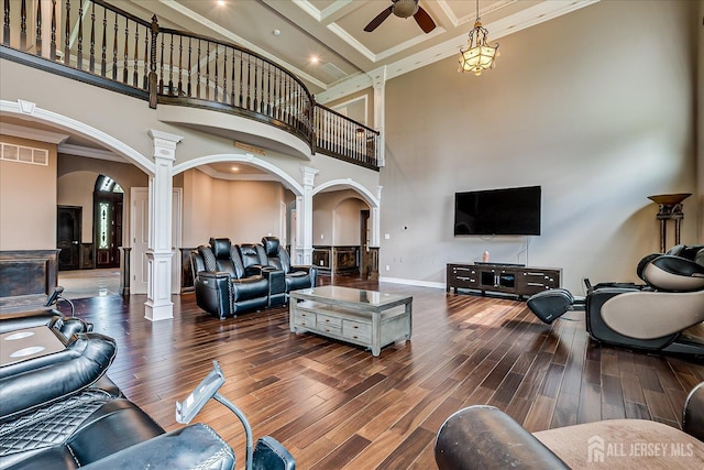 87 Ellmyer Rd, Edison, NJ 08820 - living area with arched walkways, ornate columns, a towering ceiling, a ceiling fan, and dark wood-style floors
