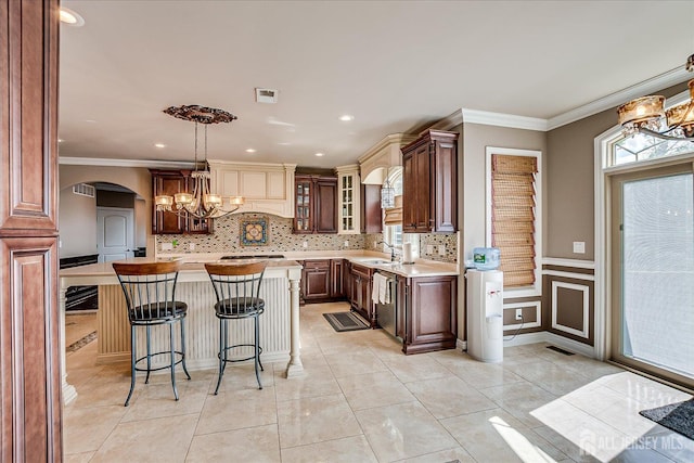 87 Ellmyer Rd, Edison, NJ 08820 - kitchen with light countertops, a kitchen island, a kitchen breakfast bar, ornamental molding, and decorative backsplash