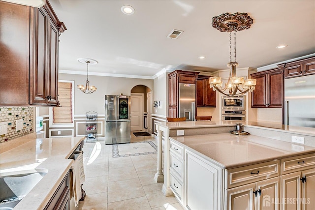 87 Ellmyer Rd, Edison, NJ 08820 - kitchen with a chandelier, stainless steel appliances, crown molding, arched walkways, and light tile patterned floors