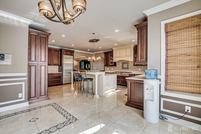 87 Ellmyer Rd, Edison, NJ 08820 - kitchen with a chandelier, stainless steel appliances, tasteful backsplash, light countertops, and a kitchen island