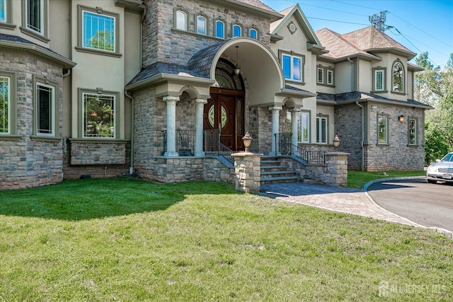 87 Ellmyer Rd, Edison, NJ 08820 - view of front of property with stucco siding, a front lawn, and stone siding