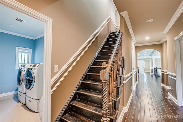 87 Ellmyer Rd, Edison, NJ 08820 - staircase with arched walkways, washer and dryer, recessed lighting, crown molding, and wood finished floors