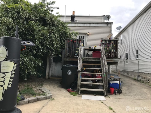 335 Alpine St, Perth Amboy, NJ 08861 - rear view of house with a wooden deck and stairs