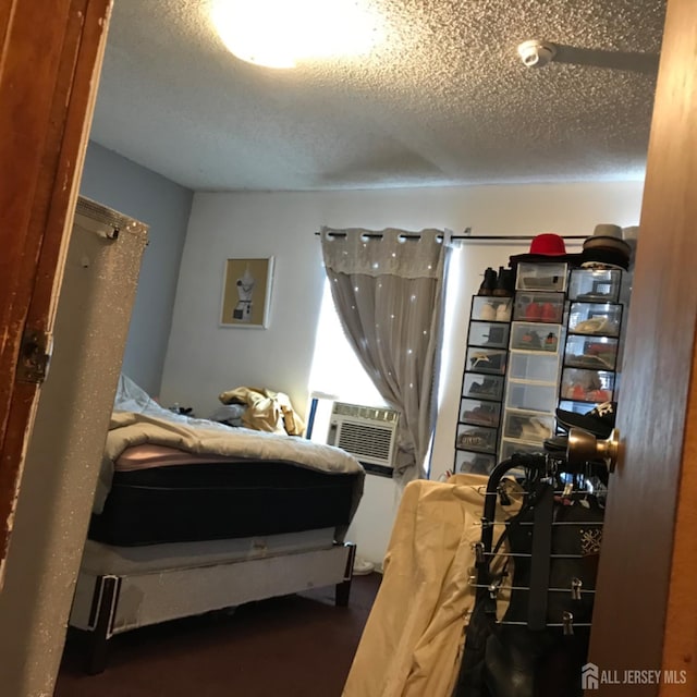 335 Alpine St, Perth Amboy, NJ 08861 - bedroom with a textured ceiling and cooling unit