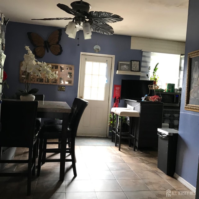 335 Alpine St, Perth Amboy, NJ 08861 - dining area featuring a ceiling fan and light tile patterned floors