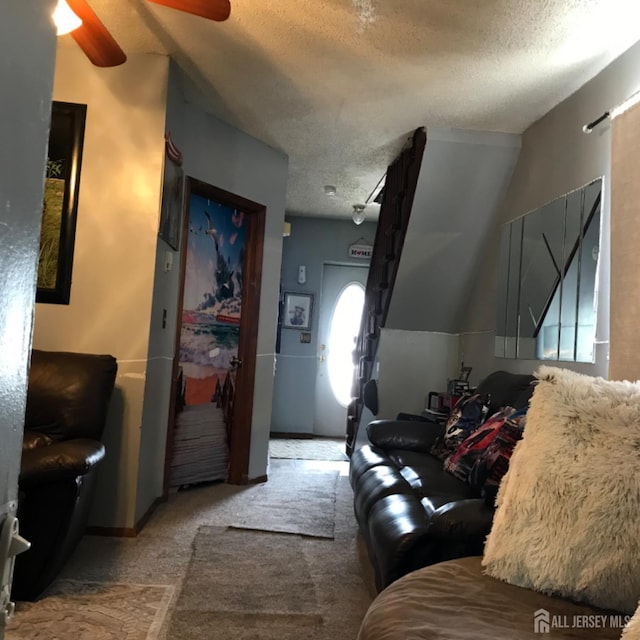 335 Alpine St, Perth Amboy, NJ 08861 - carpeted living area featuring a textured ceiling and a ceiling fan