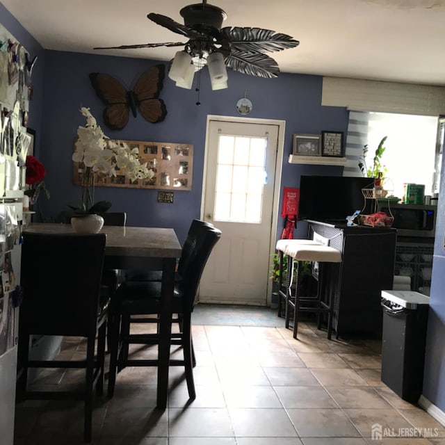 335 Alpine St, Perth Amboy, NJ 08861 - dining space featuring a ceiling fan and light tile patterned flooring