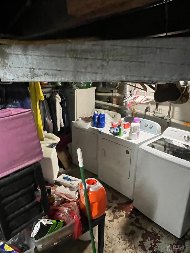 clothes washing area featuring washer and dryer