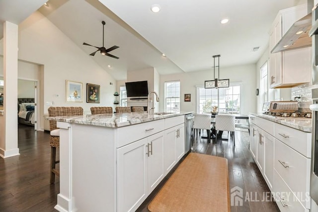 20 Metro Dr, Monroe, NJ 08831 - kitchen with a sink, a ceiling fan, dark wood-style flooring, white cabinetry, and wall chimney range hood